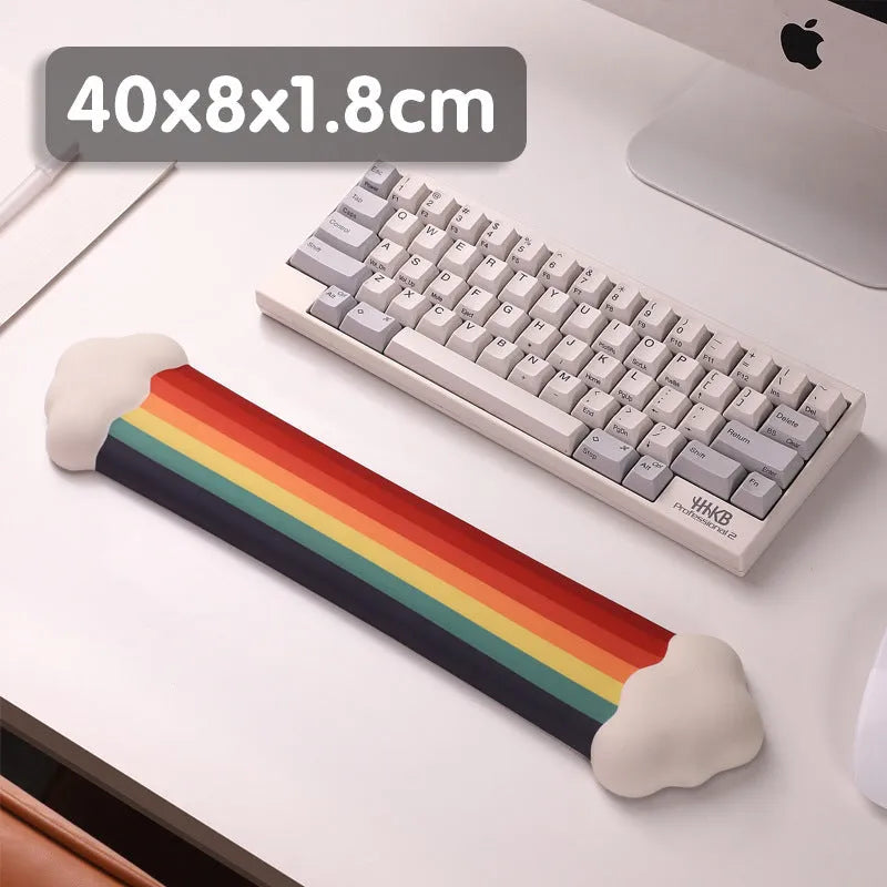 Silicone wrist rest mouse pad and keyboard holder set with cloud pattern on a desk.