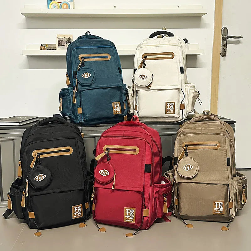 Waterproof nylon travel backpack with contrast stitching in five colour options