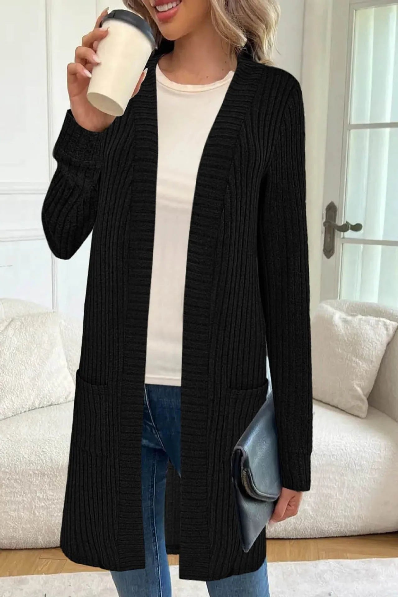 Long sleeve loose cardigan jacket in black, wine red, or grey with pockets, shown on a hanger.