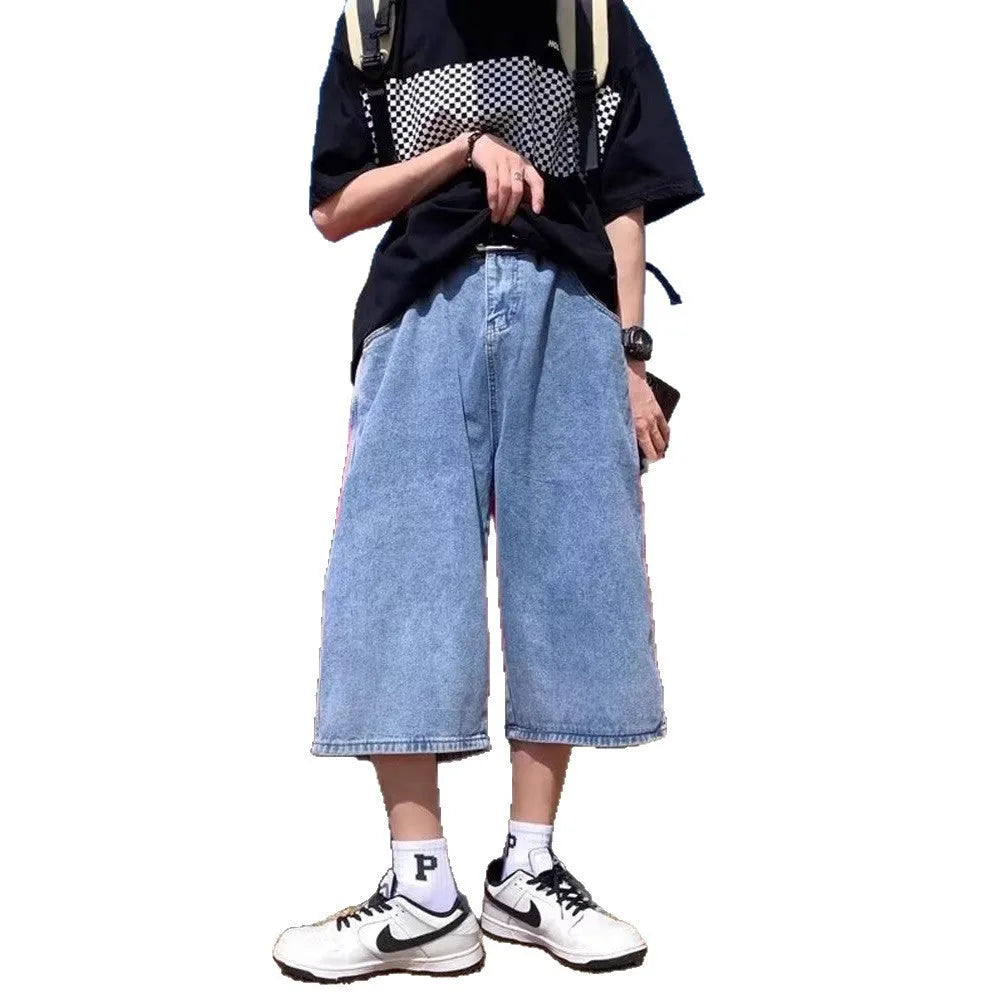 Men's blue washed denim pirate shorts with a high waist, zip fly, and straight cropped legs.