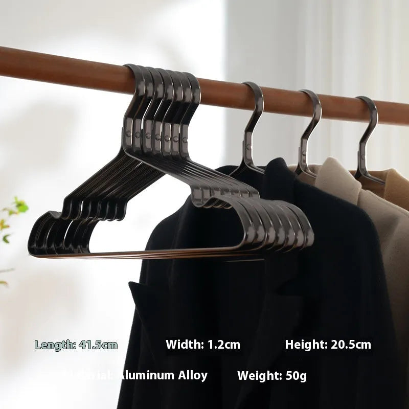 Elegant black non-slip metal clothes hanger for suits and trousers.