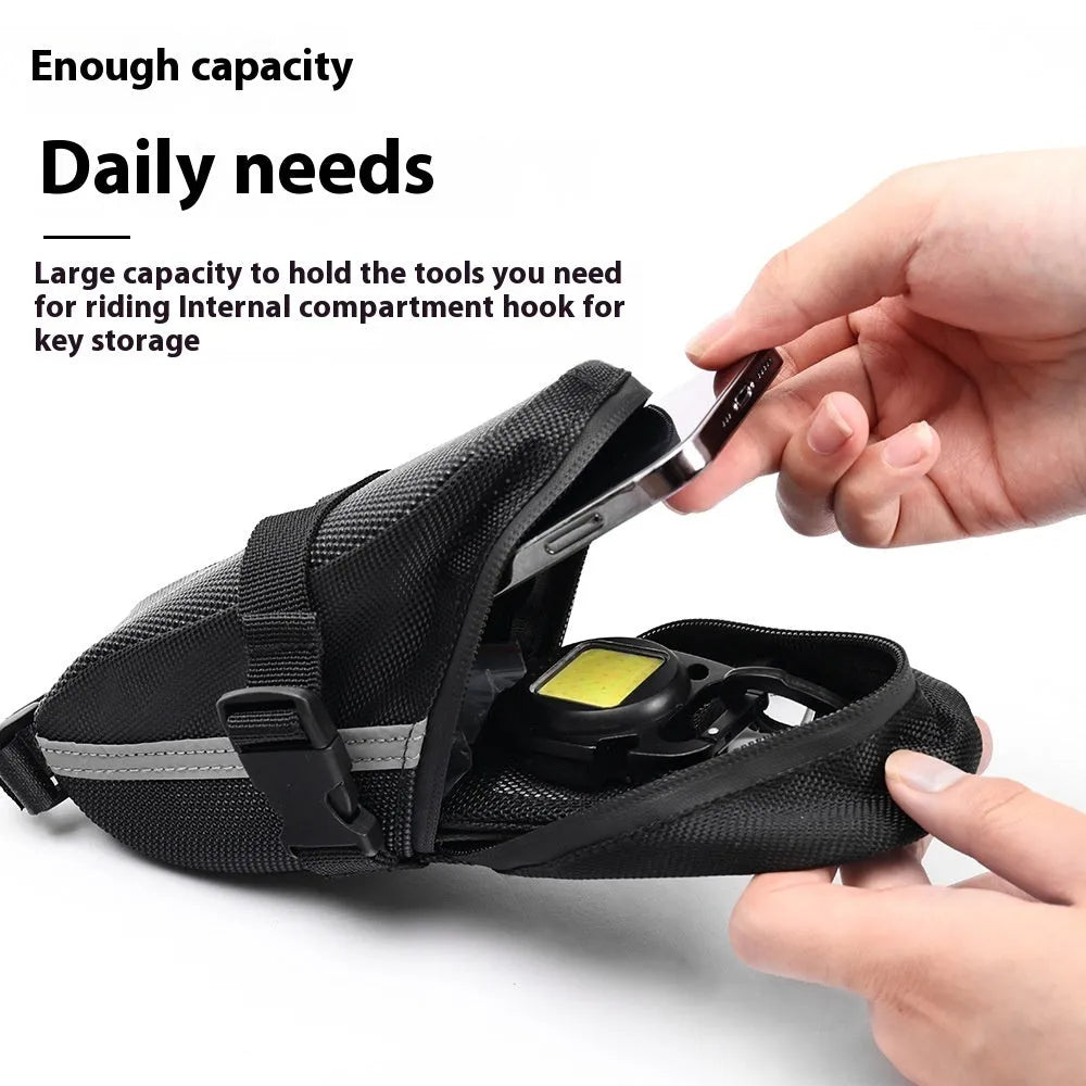 Black quick release bicycle saddle bag mounted under bike seat with tool capacity dimensions 20x8x6cm