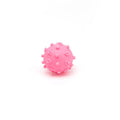 Set of four bright blue, green, pink, and yellow 2-inch squeaky dog toy balls with a textured, dimpled surface.