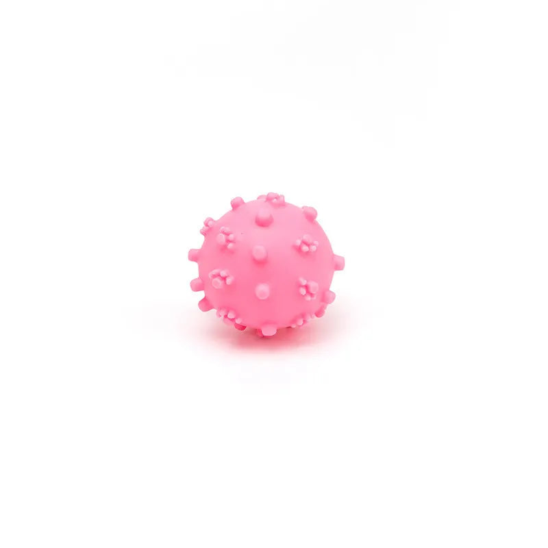 Set of four bright blue, green, pink, and yellow 2-inch squeaky dog toy balls with a textured, dimpled surface.
