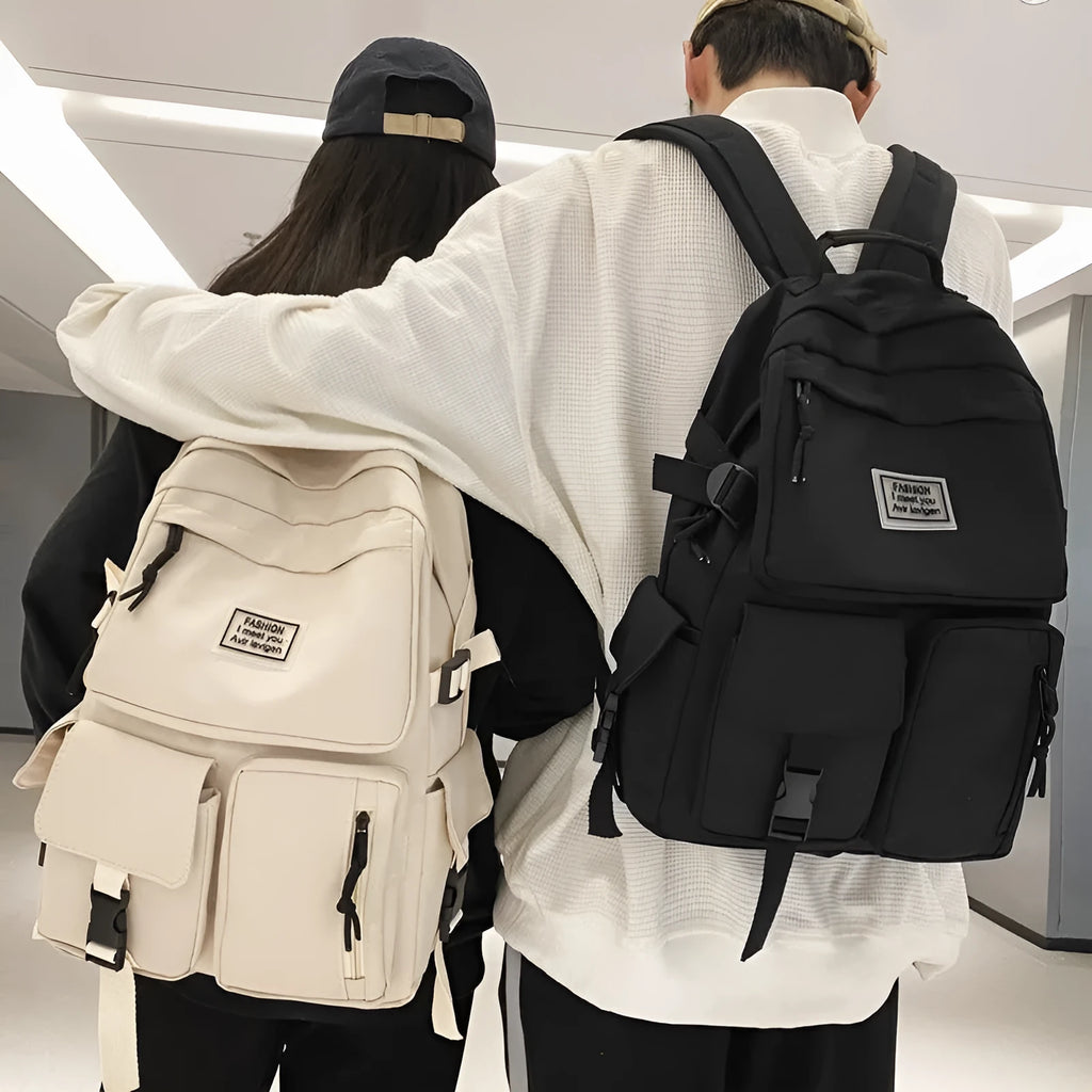 Soft nylon student backpack in black with three-dimensional pockets and laptop compartment