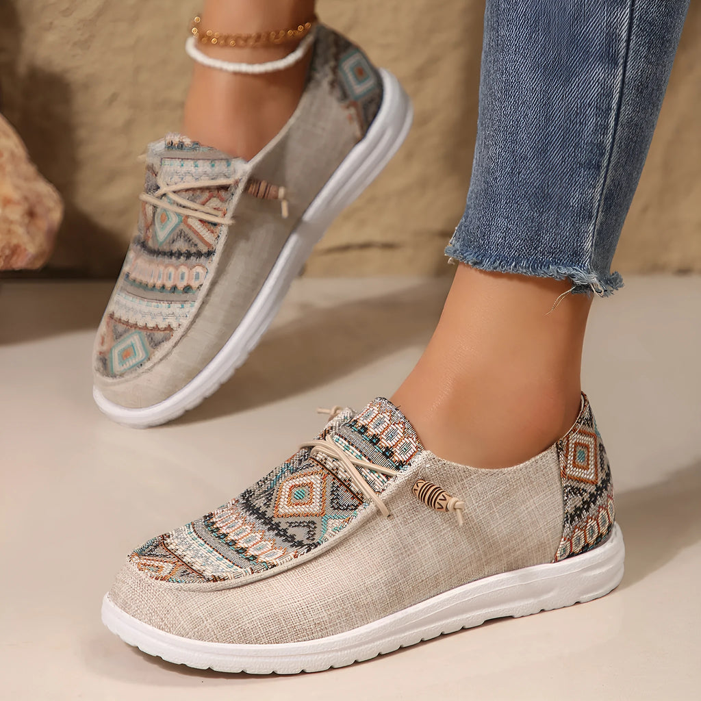 Women's black round toe low-top flat shoes with a rubber sole on a white background