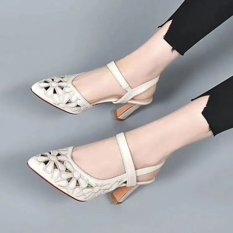 Women's red pointed toe backless sandals with high heel and hollowed toe box detail on a white background.