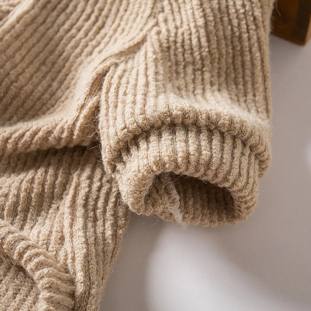 Brown knitted pullover sweater on a small dog, showing casual design and soft fabric.