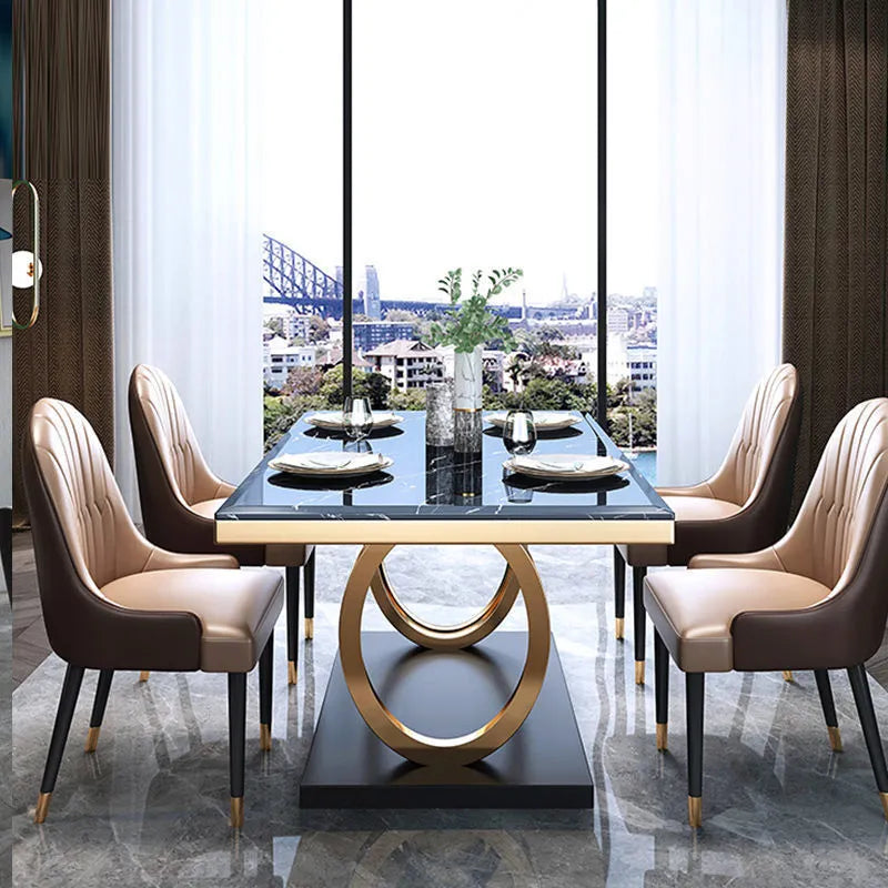 Rectangle slate dining table with marble finish and metal frame, shown with pineapple or round-back chairs