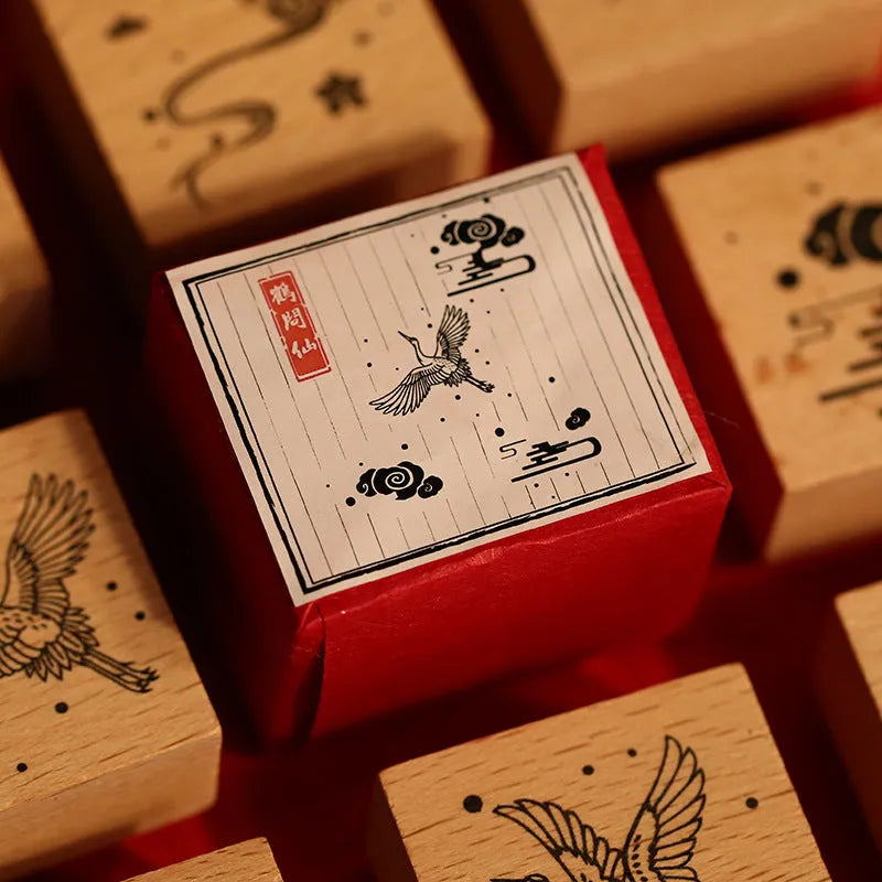 Wooden handled rubber stamp with hand-carved crane design for DIY paper crafting