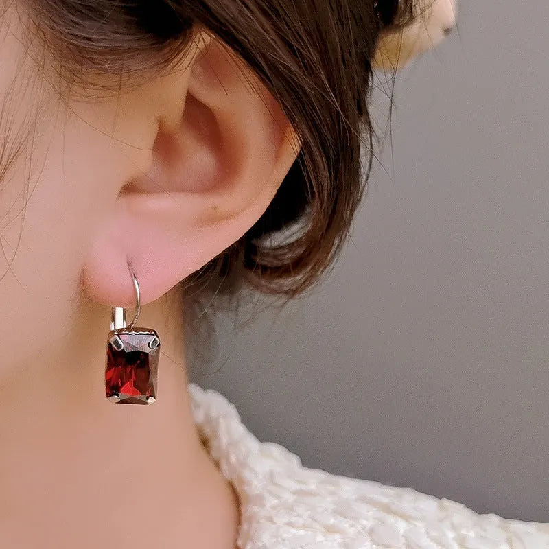 Women's square crystal copper earrings measuring 25mm by 10mm in purple, red and yellow colours