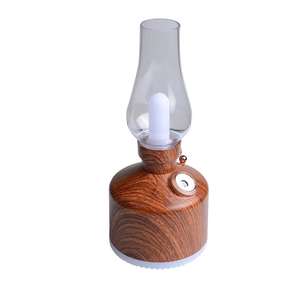 Kerosene lamp ultrasonic humidifier with grey ABS shell on a wooden desk showing single fog outlet