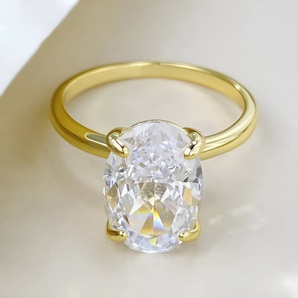 Oval gemstone ring for women in sterling silver with a four-claw setting, shown in gold and silver plating options.