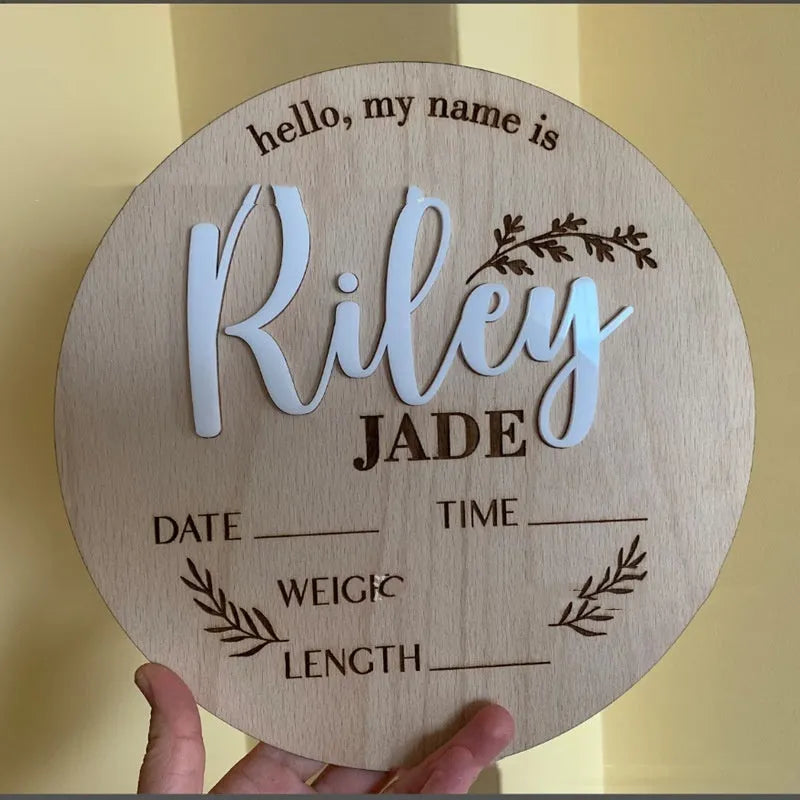 Square wooden baby name plaque with birth information, 15cm by 15cm.