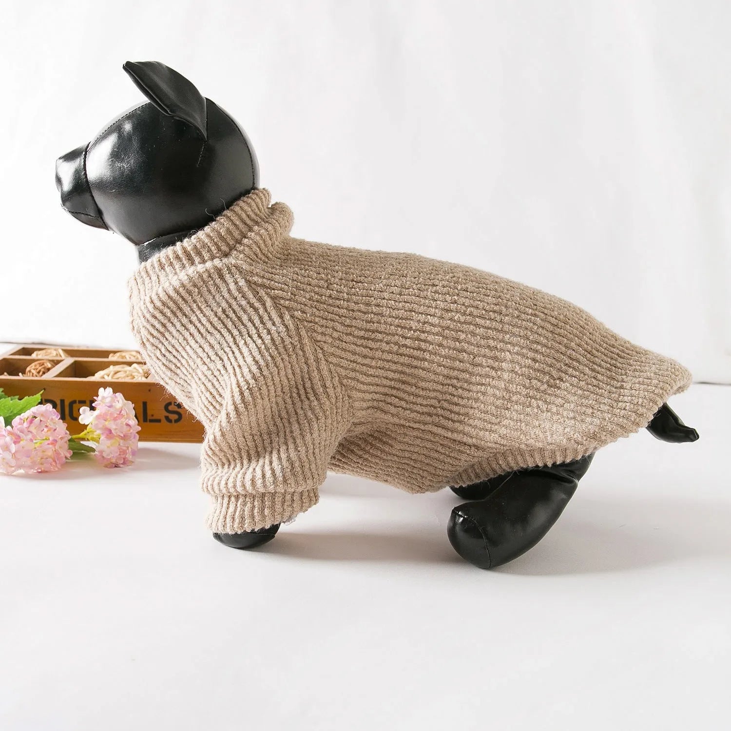 Brown knitted pullover sweater on a small dog, showing casual design and soft fabric.