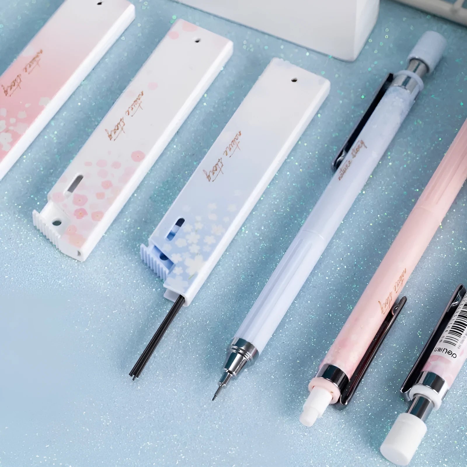 Mixed colour cartoon automatic pencil set with three 0.5mm pens and three boxes of HB refills.