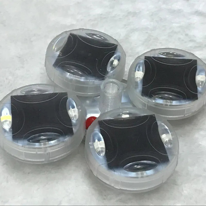 Colourful solar-powered LED valve stem cap light for car or bike wheel.