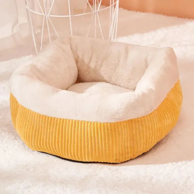 Washable circular cat sofa bed in yellow with plush fabric and non-slip base for calming sleep