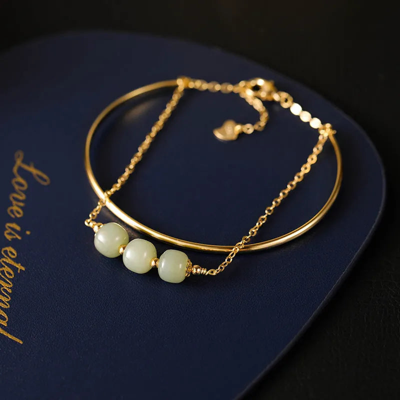 Women's jade lucky beads bracelet with gold inlay design in single, double, and three bead versions