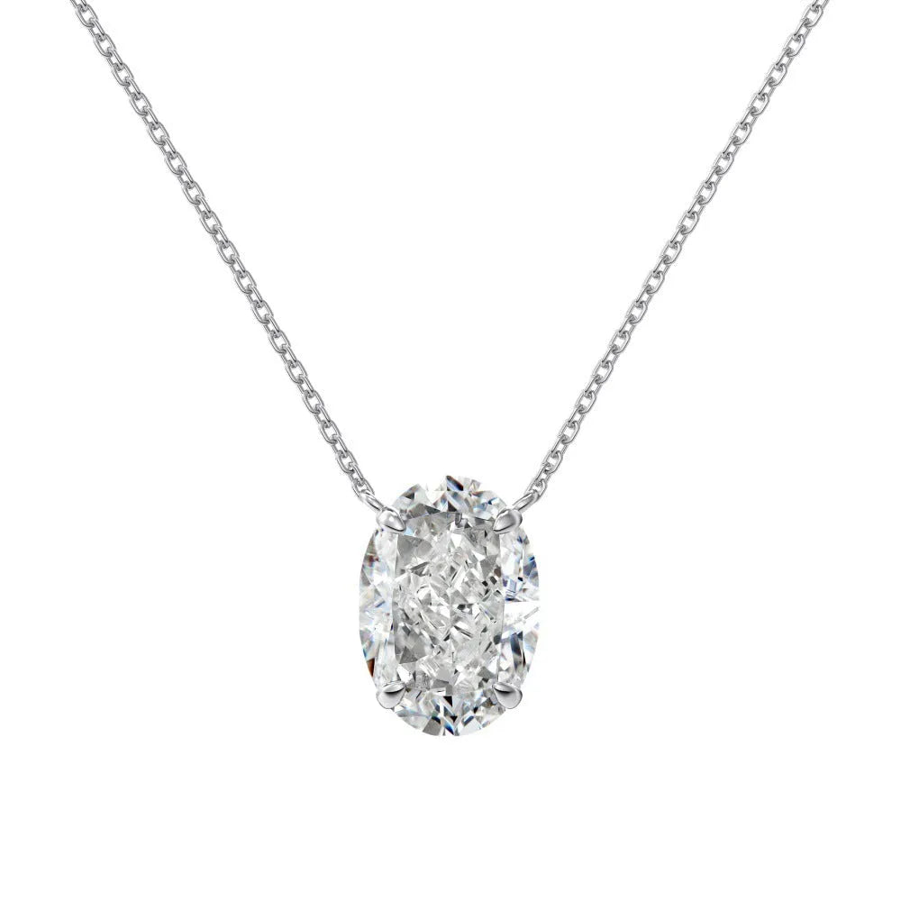 Close-up of a women's sterling silver necklace with a geometric oval ice flower pendant.