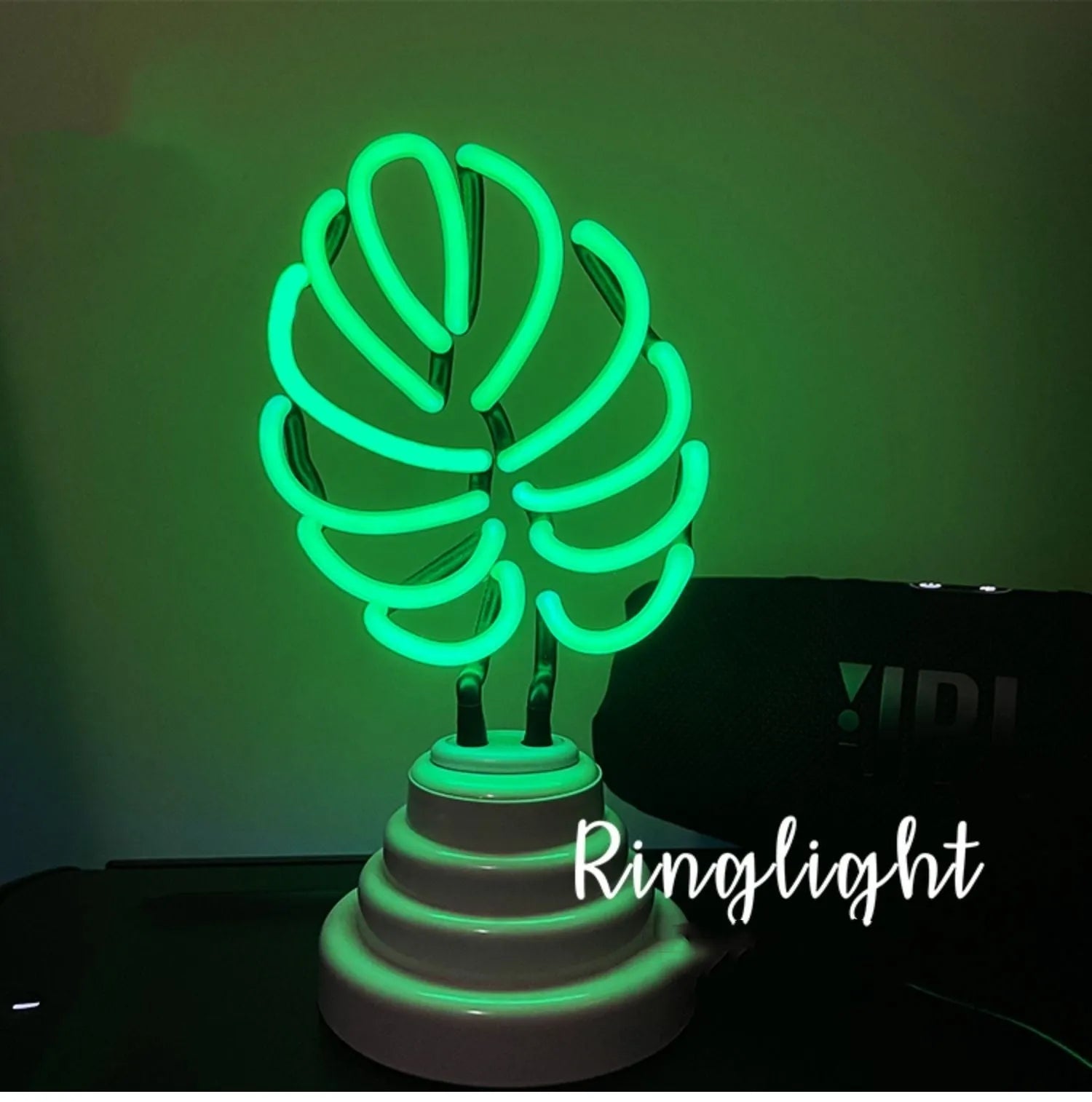 Minimalist green light bamboo desk lamp with USB plug on a wooden table.