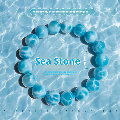 Blue handmade Bodhi bracelet with natural crystal, sea-pattern stone, and pearl in Maillard style.