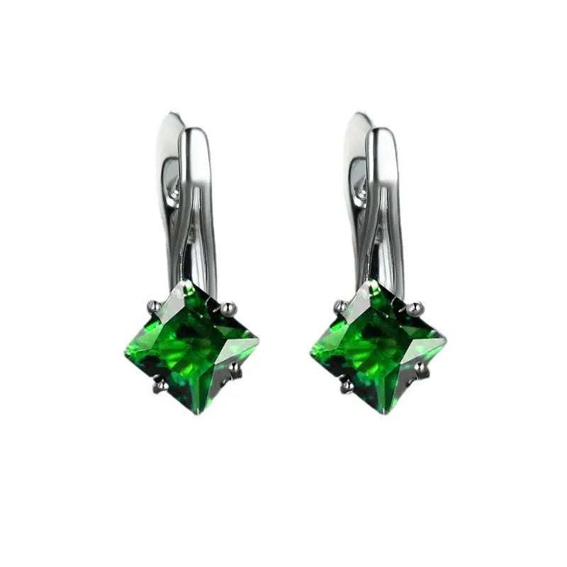 A pair of women's copper earrings with a diamond design and inlaid blue zircon stones.
