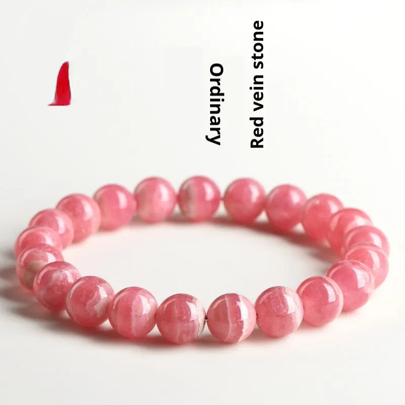 Women's geometric crystal bracelet with a longevity lock, shown in rhodochrosite colours.