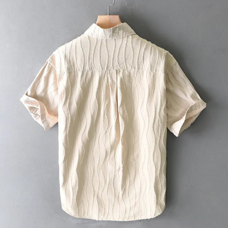 Men's apricot pure cotton loose-fit short sleeve casual shirt on a hanger.