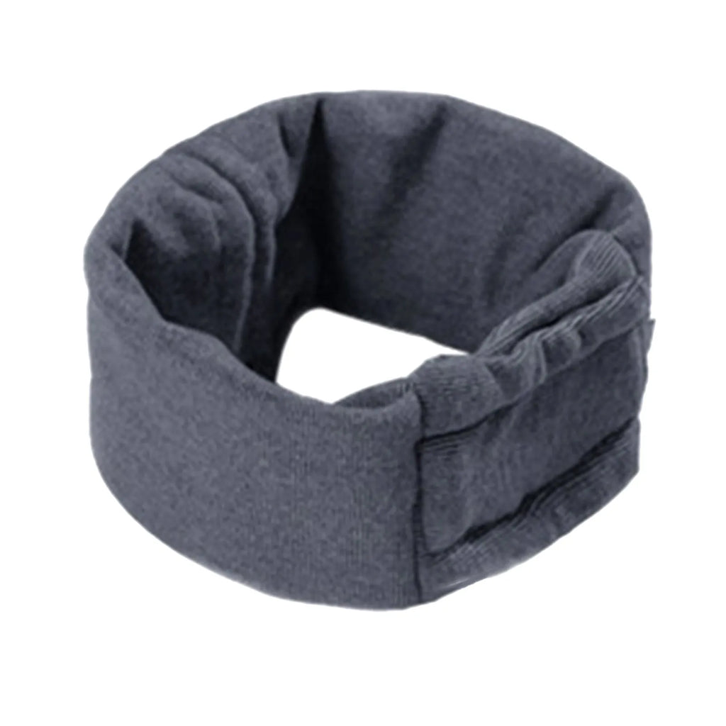 Dog wearing black calming hoodie covering ears with multi-purpose design for noise reduction and hair management