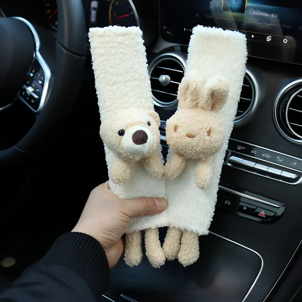 Cartoon plush seat belt shoulder protector in lamb wool with bear and rabbit designs.