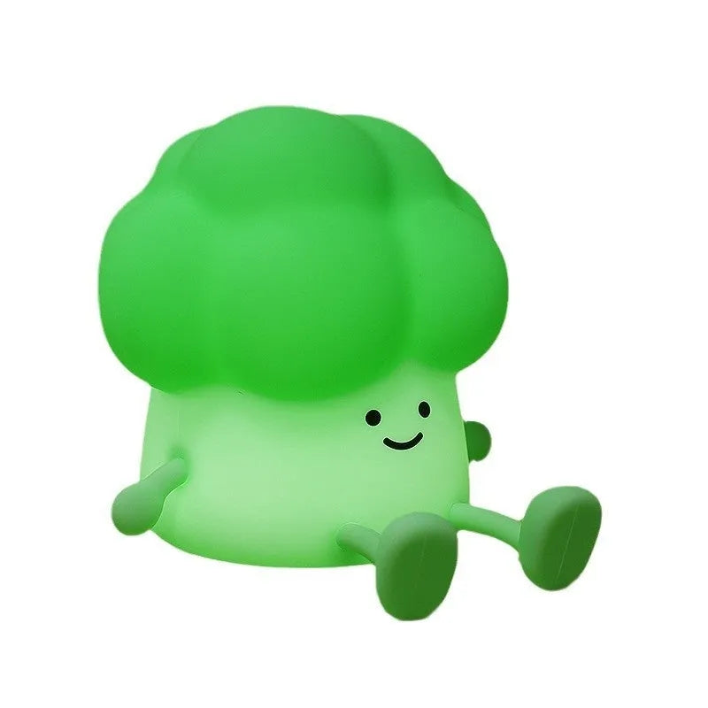 Cartoon eggplant small night lamp with soft yellow light beside broccoli design night light