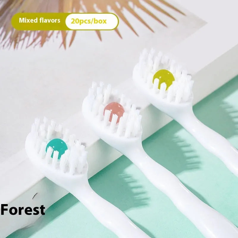 Box of 20 disposable beaded travel toothbrushes in individual wrappers.