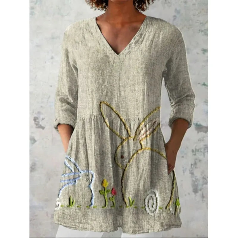 Women's loose fit printed dress with wide waist and three-quarter length sleeves.