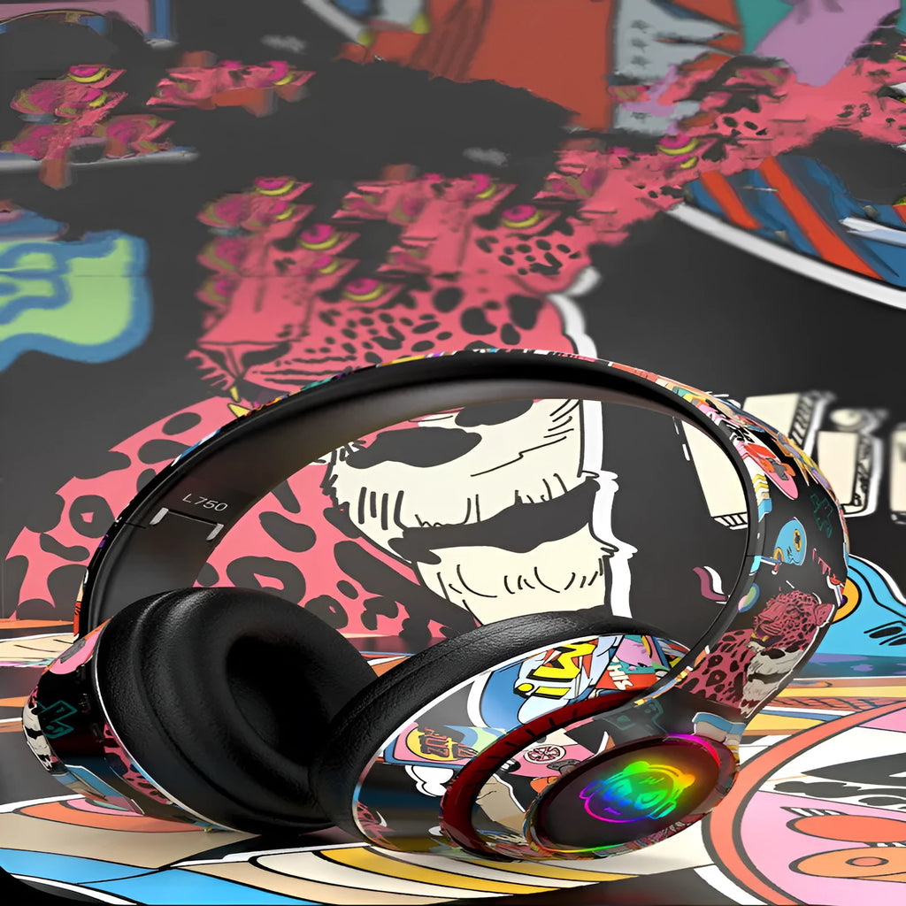 Graffiti wireless Bluetooth headset in black or white, showing head-mounted design.