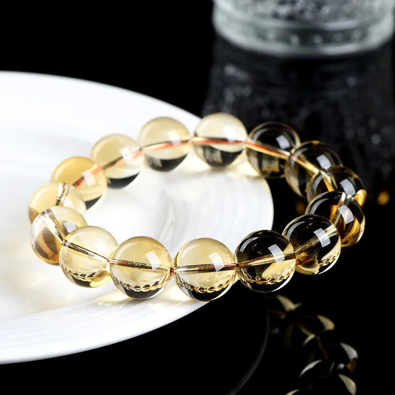 Natural citrine scattered beads ball bracelet showing golden polished stones on a wrist, available in 7A and 6A grades.
