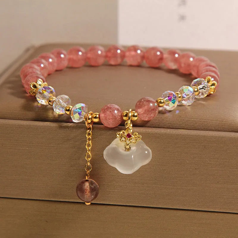 Women's adjustable crystal bracelet with strawberry quartz and white agate beads featuring auspicious cloud charm