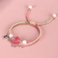 Red cat's paw woven bracelet handmade from glass and coloured glaze in pink or yellow couple style