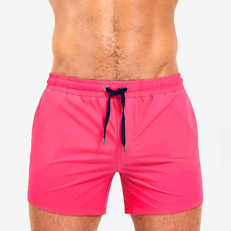 Polyester mesh-lined sports shorts in solid colours for swimming and fitness.