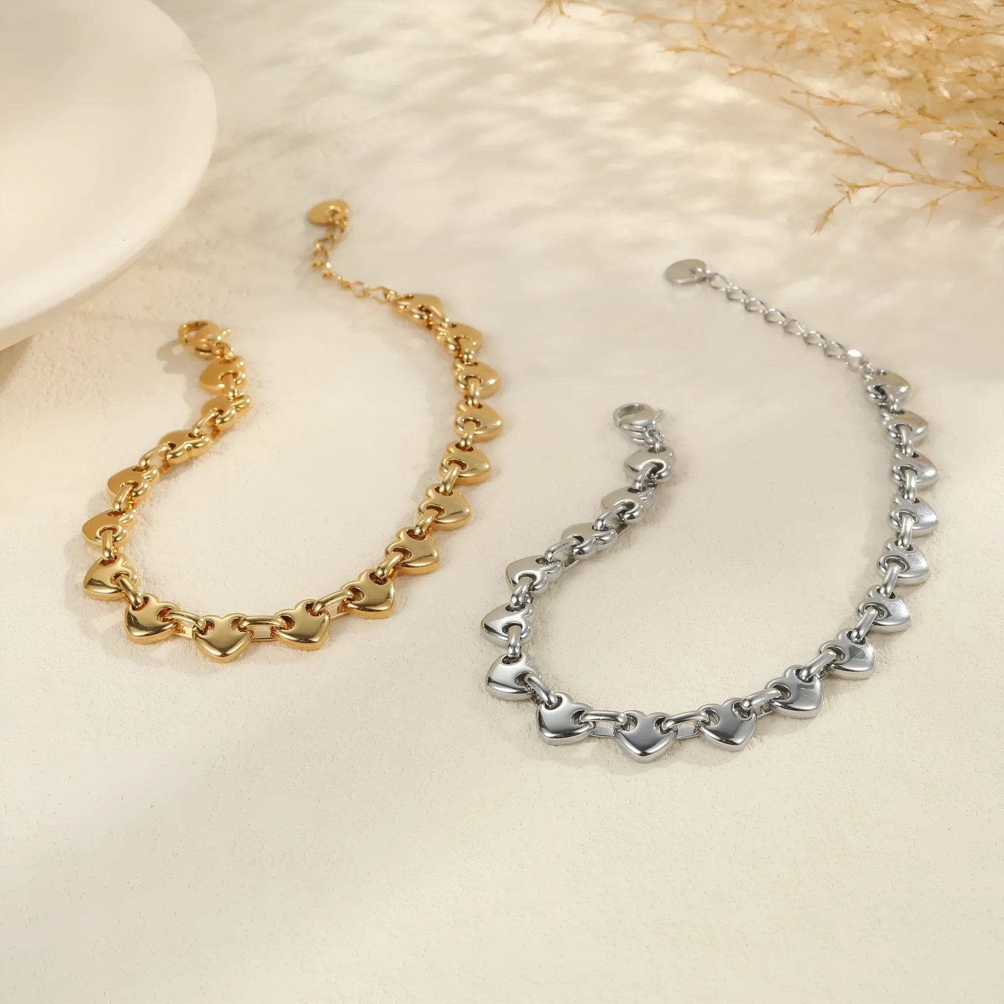 Women's stainless steel bracelet with hollowed-out geometric heart design in gold or steel colour