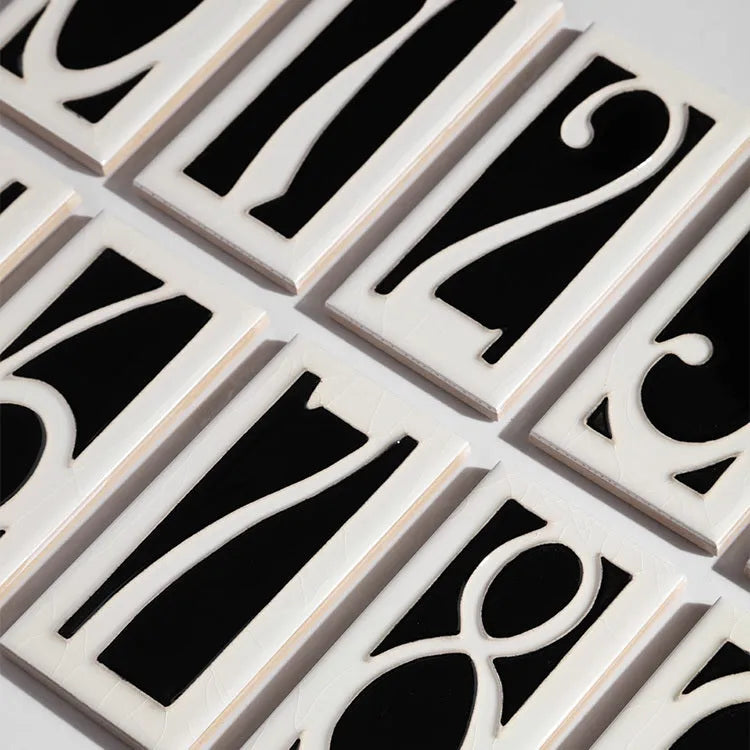 Handmade retro-style ceramic doorplate with enamel number, shown in 76mm by 152mm size.