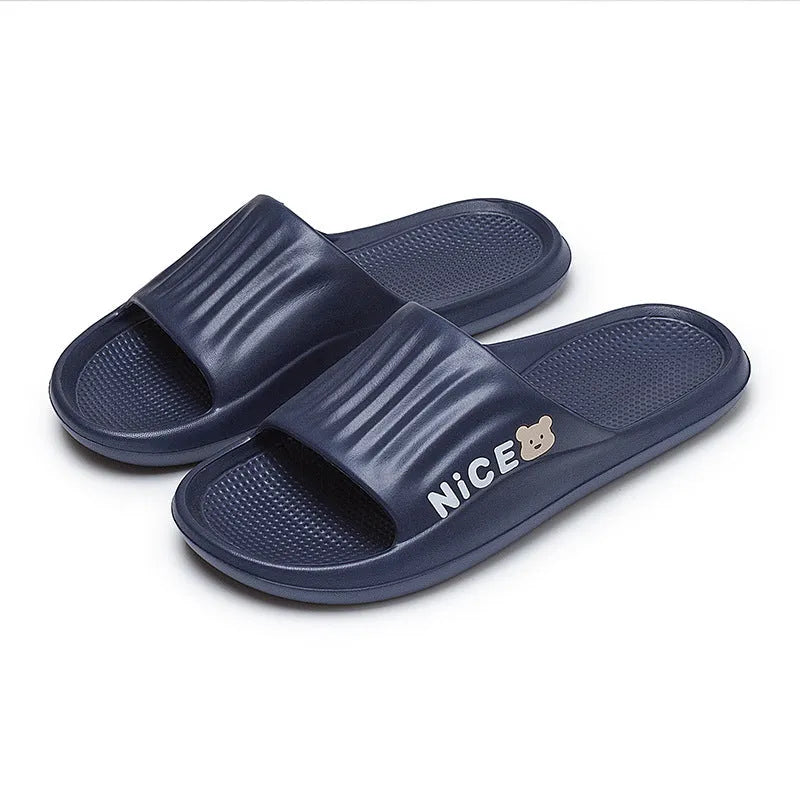 Adult unisex EVA cartoon pattern flip flop slippers in black, shown from above.