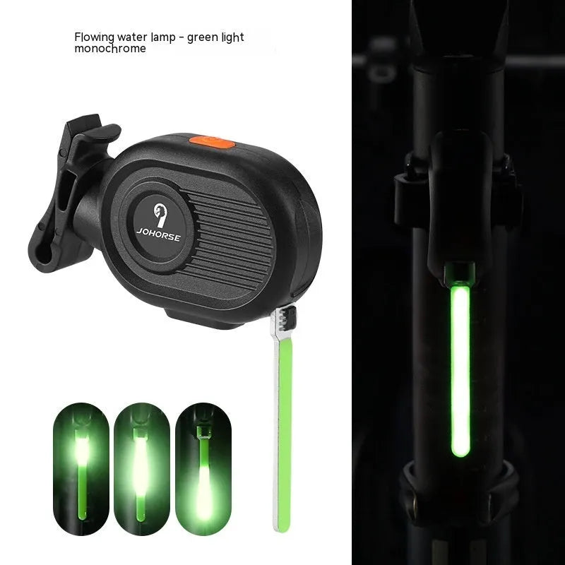 USB rechargeable bicycle tail light with blue waterfall or running water lighting effect on a bike seat post.