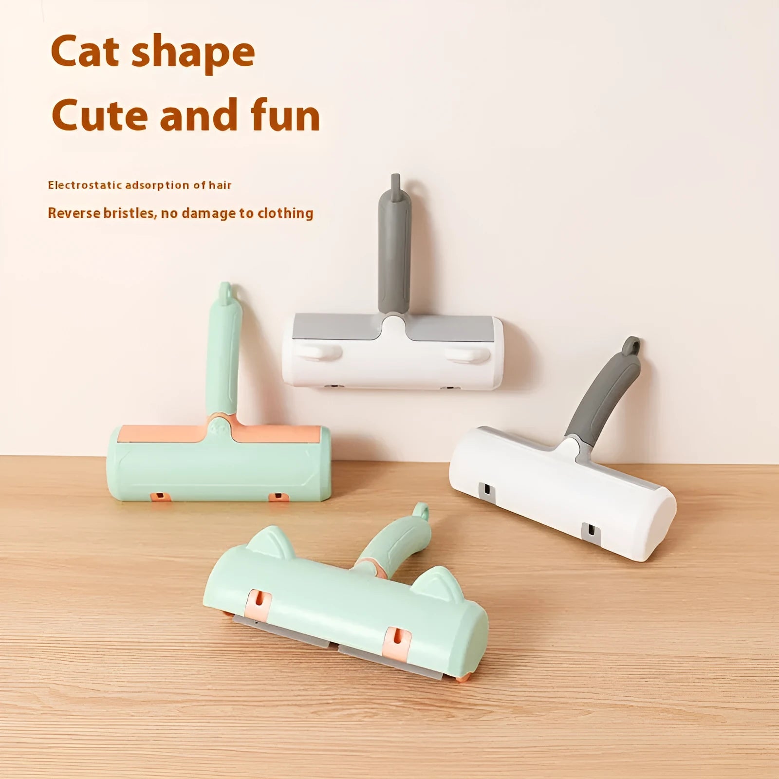 Mint green and twilight grey cat hair removal brush with two head style options on a white background.