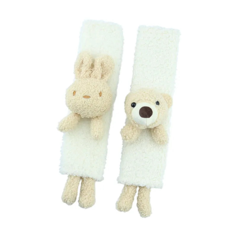 Cartoon plush seat belt shoulder protector in lamb wool with bear and rabbit designs.