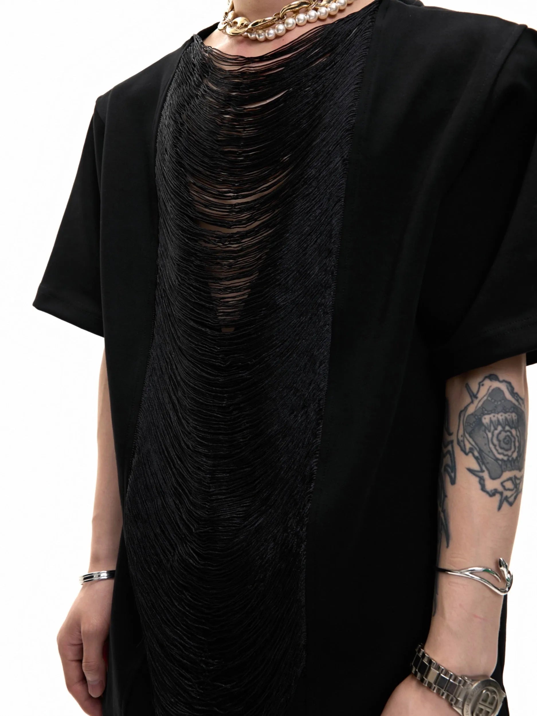 Man wearing a loose-fit drum black V-neck polyester T-shirt with short sleeves and a tassel detail.