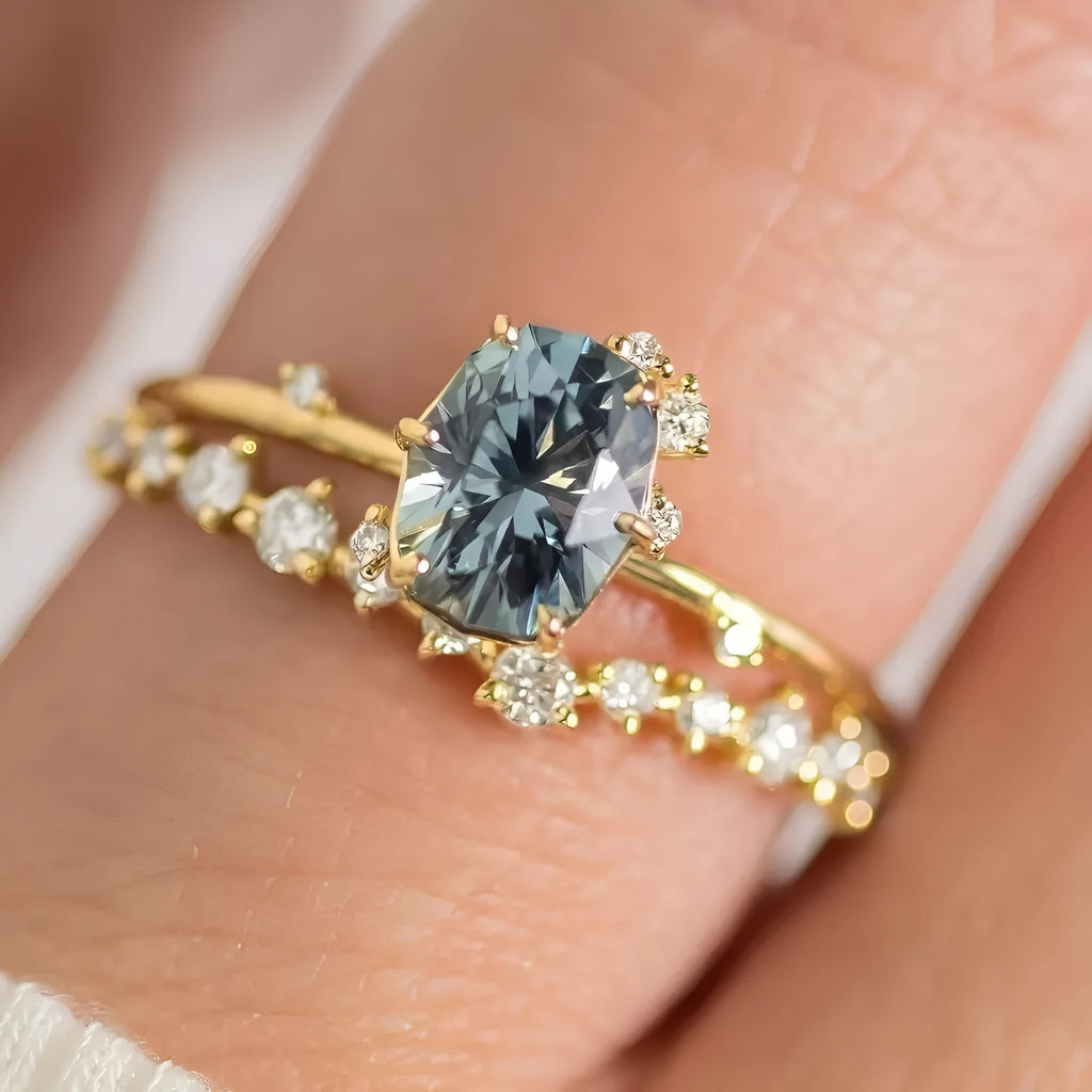 Gold plated women's ring with green zircon stone in floral design on model finger