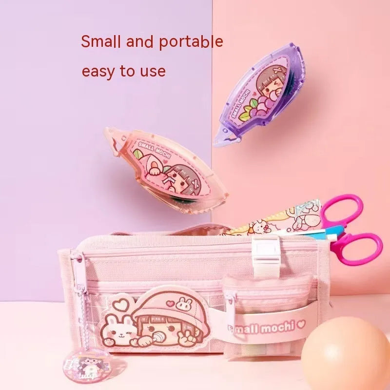 Hand account dotting glue in peach juice colour on card packaging, a high viscosity double-sided adhesive.