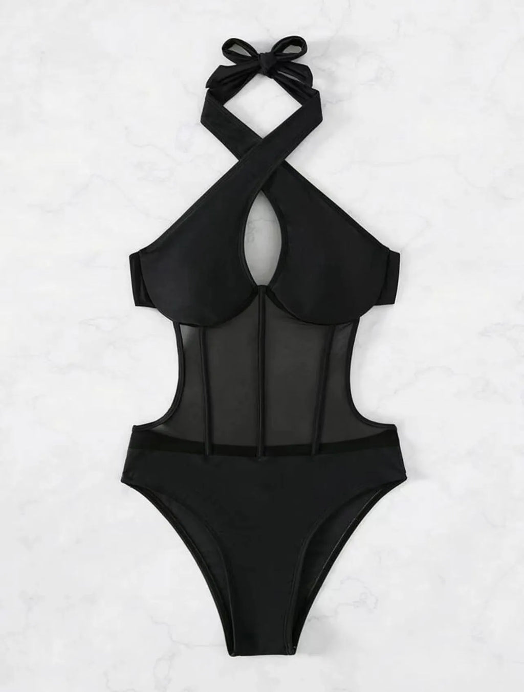 Women's black one-piece swimsuit bikini made of nylon and spandex fabric on a neutral background.