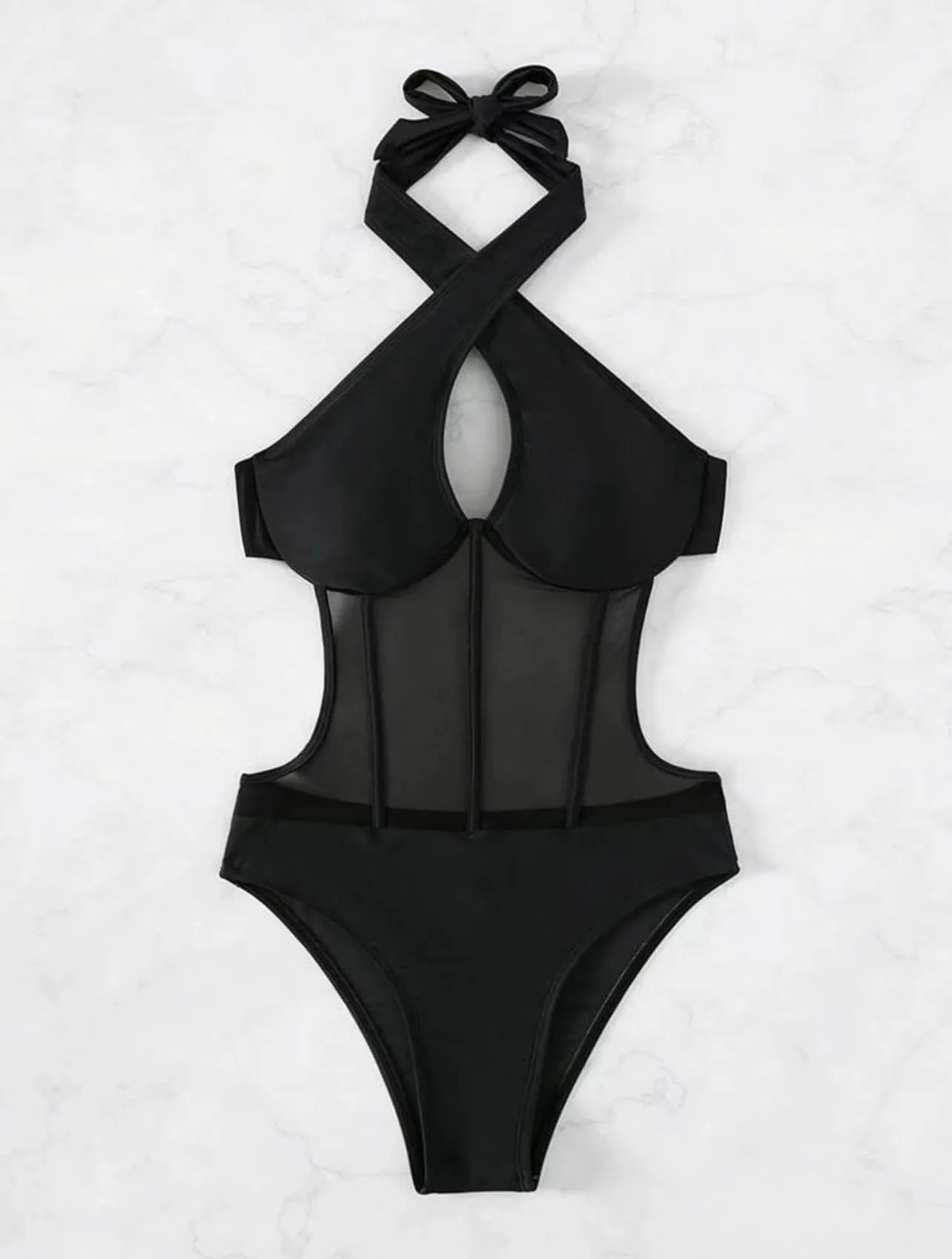 Women's black one-piece swimsuit bikini made of nylon and spandex fabric on a neutral background.